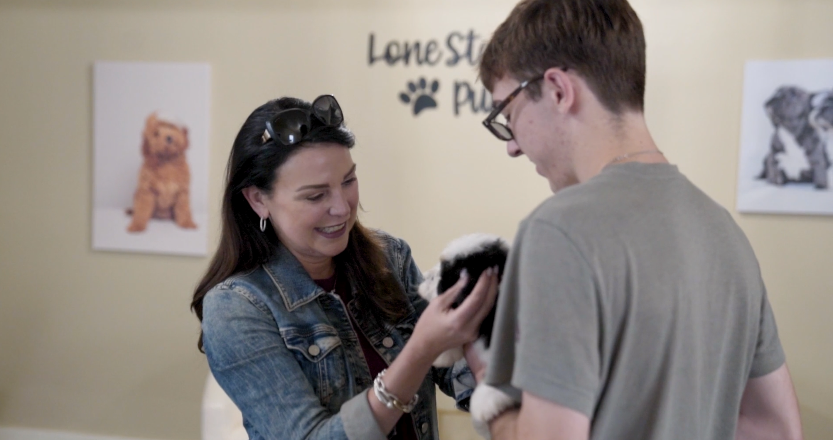 lone star pups customers with their new puppy